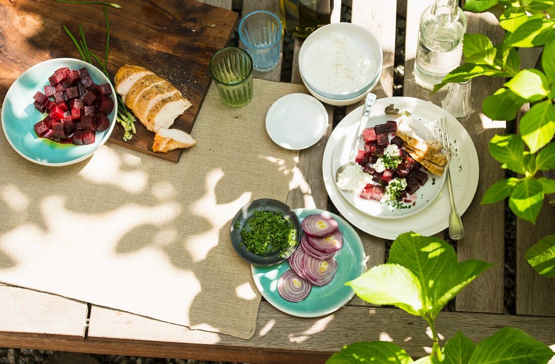 A table laid in a garden