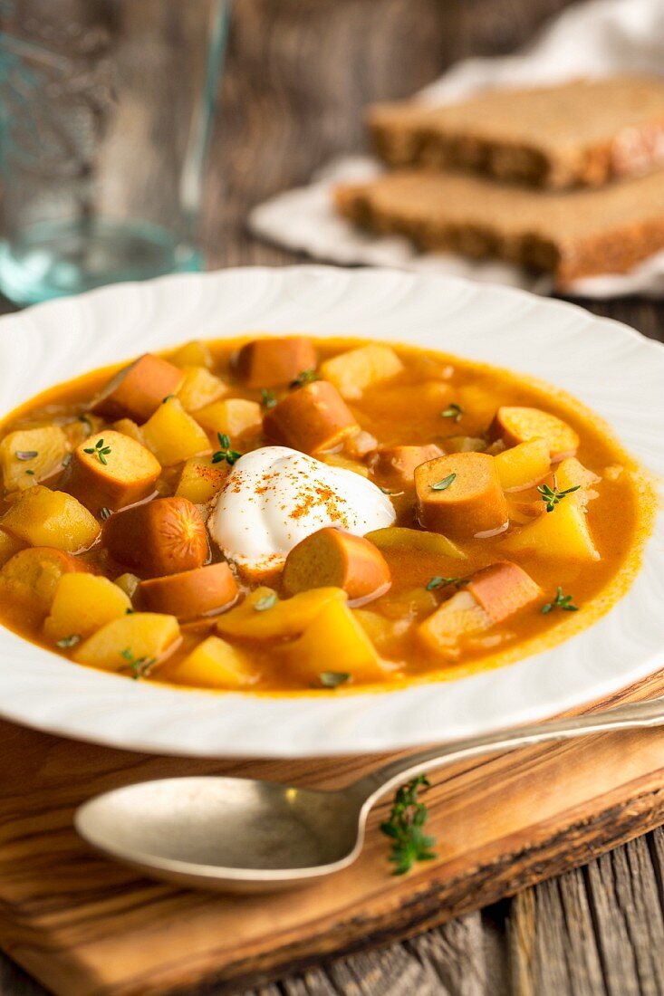 Potato soup with curry and vegan frankfurters