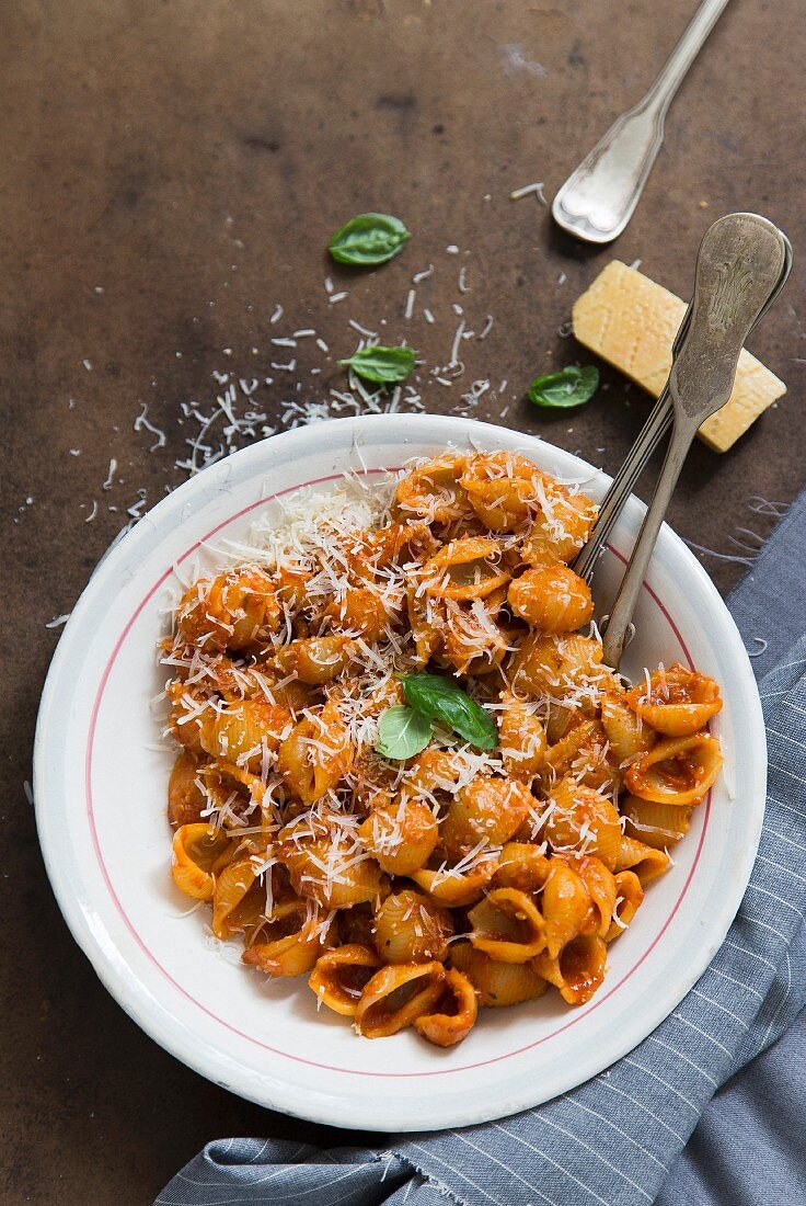 Shell pasta with tomato sauce and Parmesan cheese