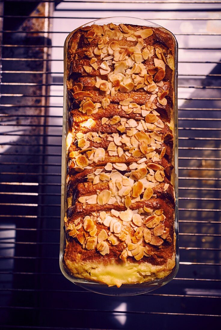 Pain perdu terrine with flaked almonds (seen from above)