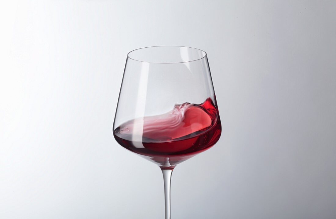 Red wine swilling in a glass