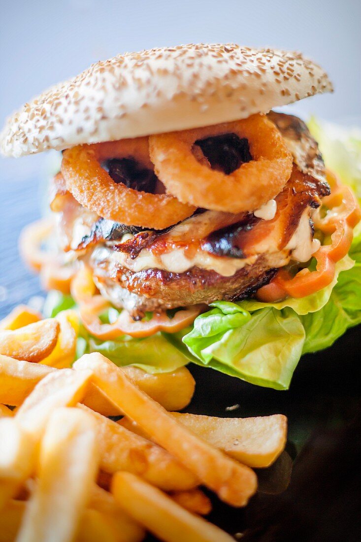 A hamburger with fried squid rings