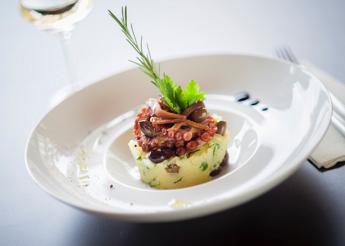 Potato cake with octopus and olives