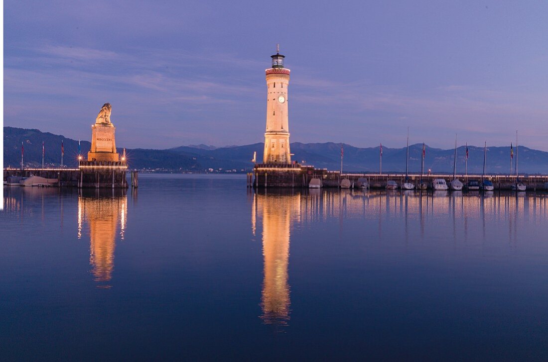 The port entrance at Lindau with the new lighthouse and lion statue, Lake Constance