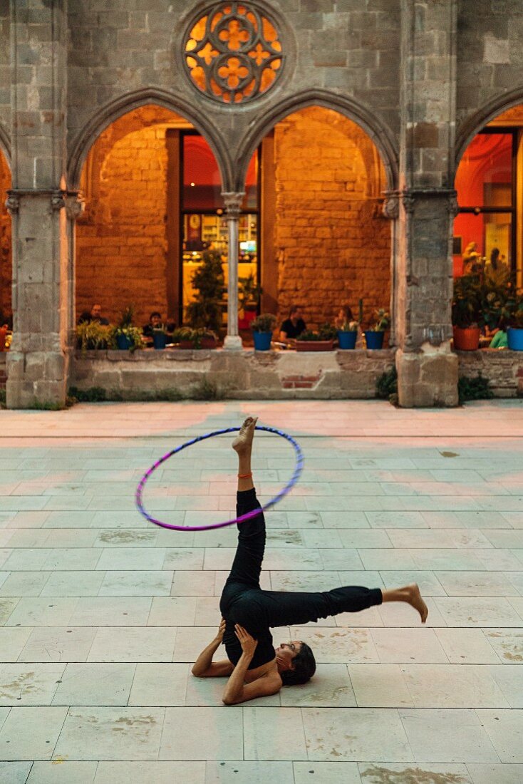 A hula-hoop artiste in the Parque de la Ciutadella in the El Born quarter, Barcelona