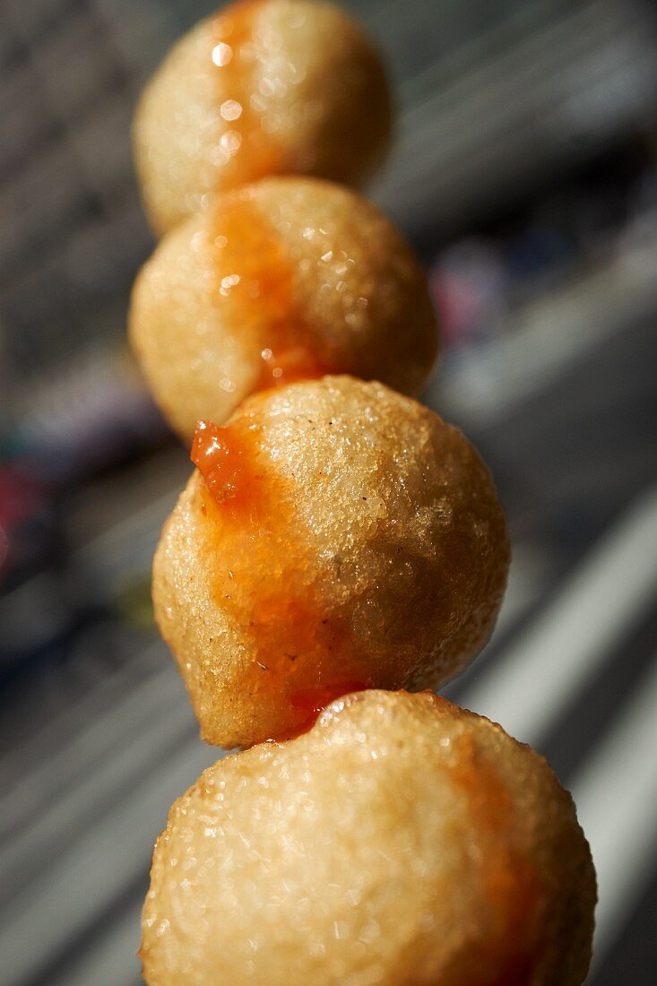 Deep-fried fish balls on a skewer (China) as street food