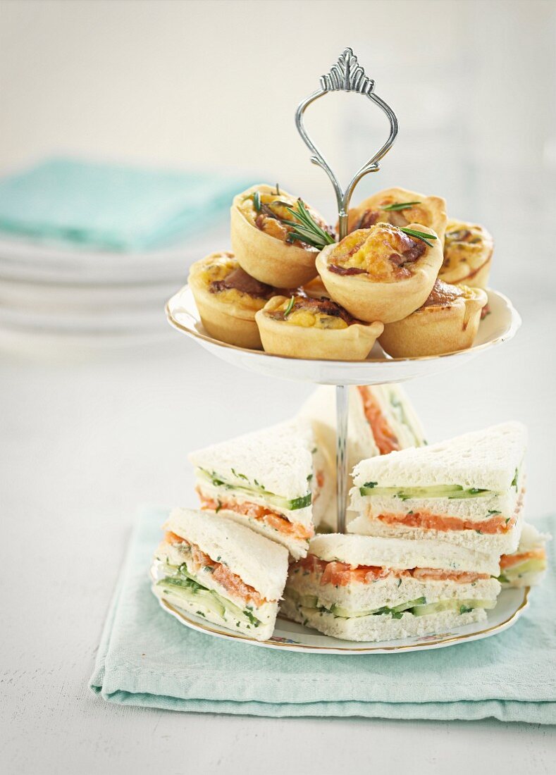 Sandwiches and spicy tartlets on a cake stand