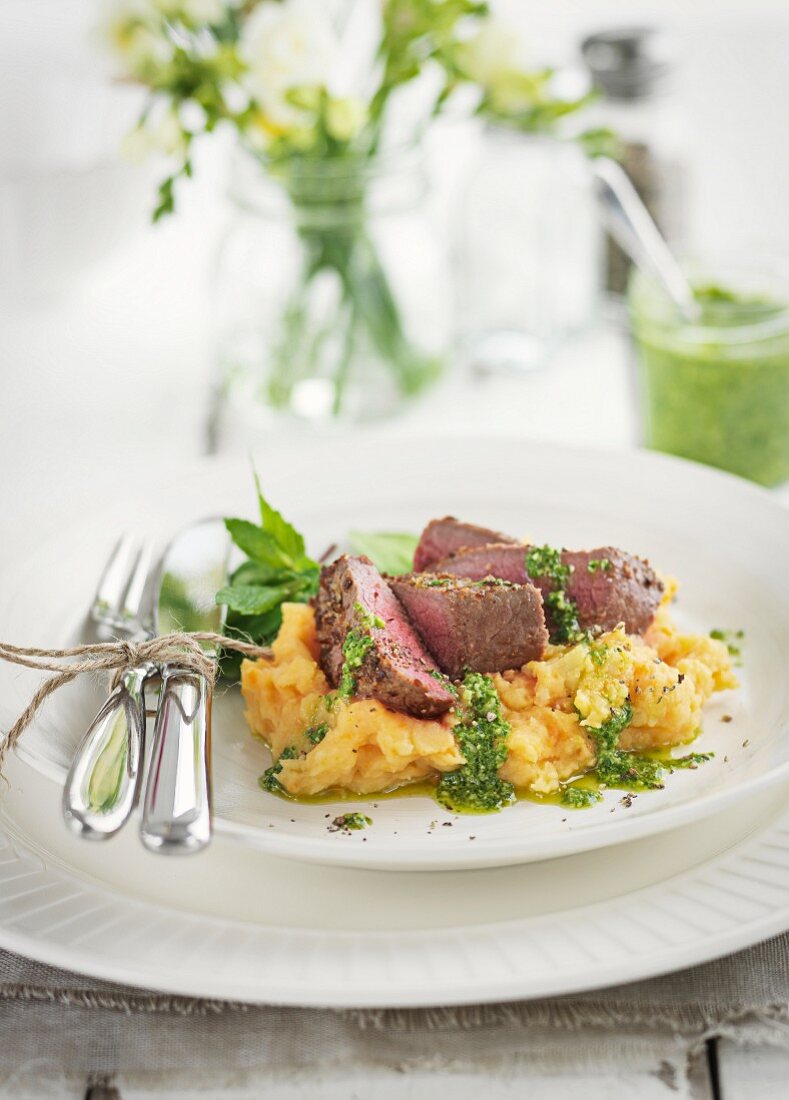Lamb steak with mashed potatoes and mint sauce