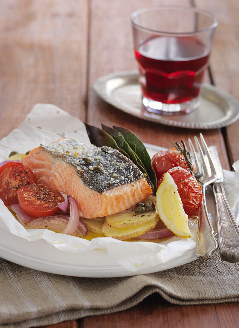 Salmon with vegetables in parchment paper