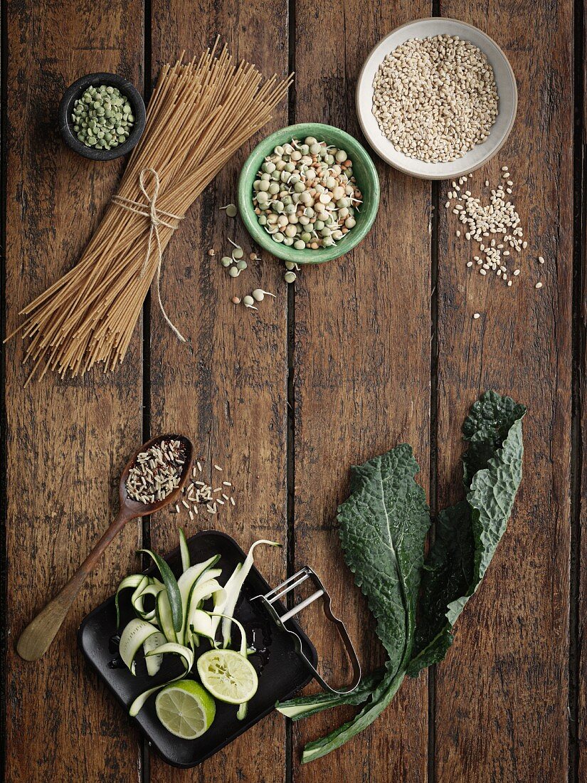 An arrangement of pasta, seeds and cabbage leaves