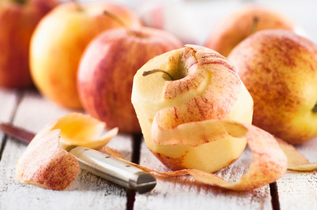 Royal Gala apples, one peeled