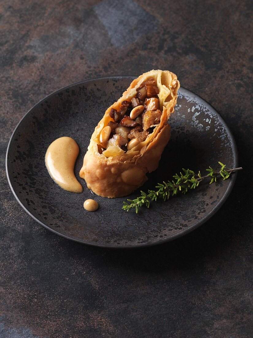 Hearty chestnut strudel with dark beer sabayon