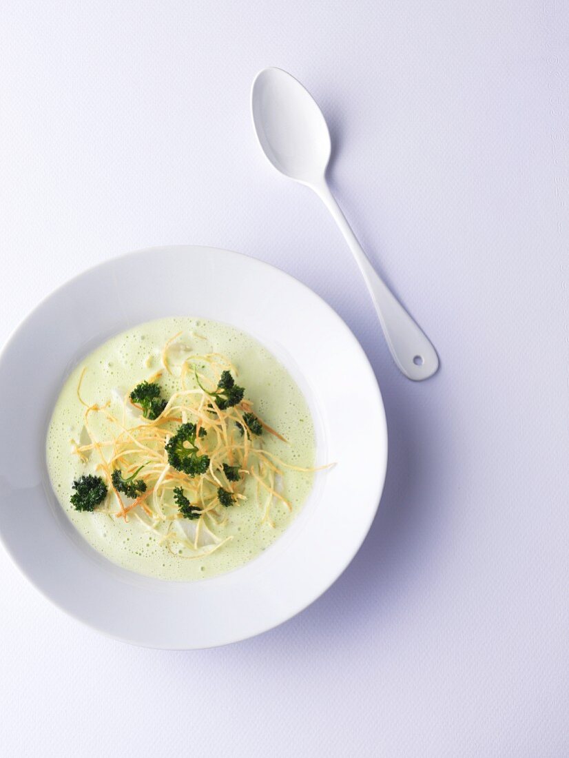 Green parsley root soup with fried parsley root spaghetti