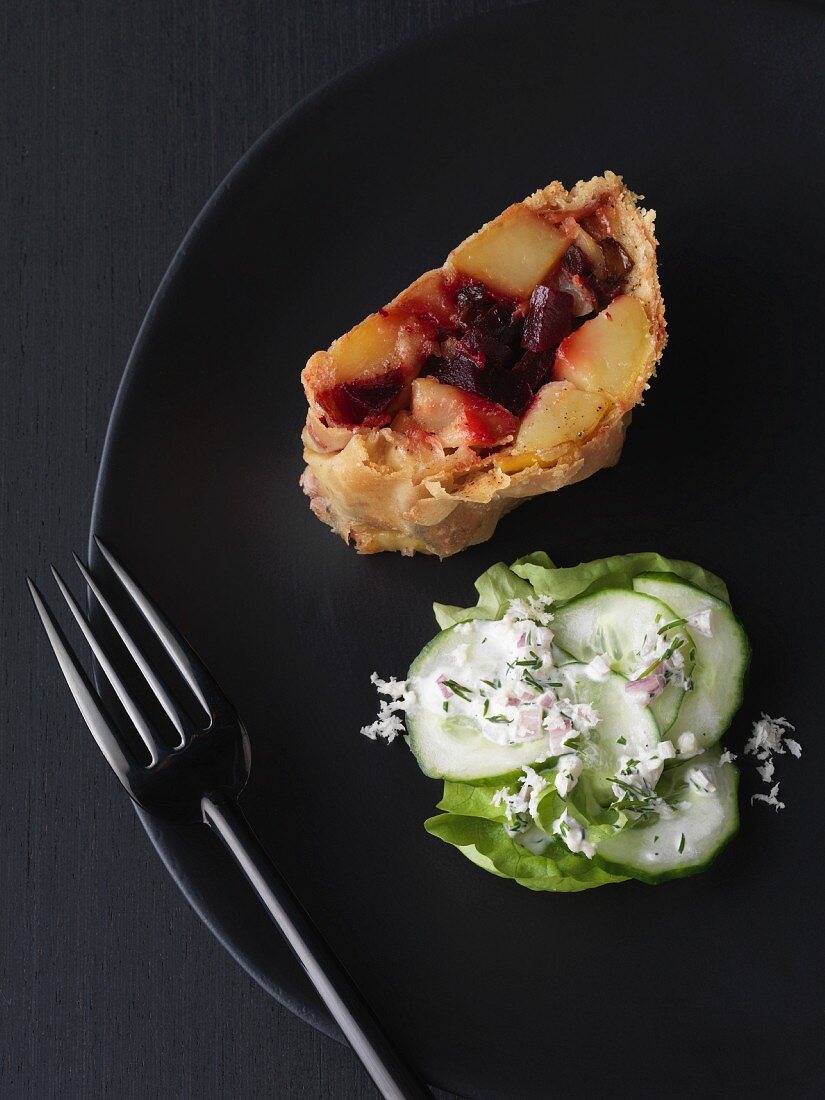 Spelt potato strudel with horseradish and cucumber salad