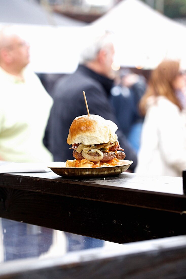 A deluxe hamburger on a sales counter