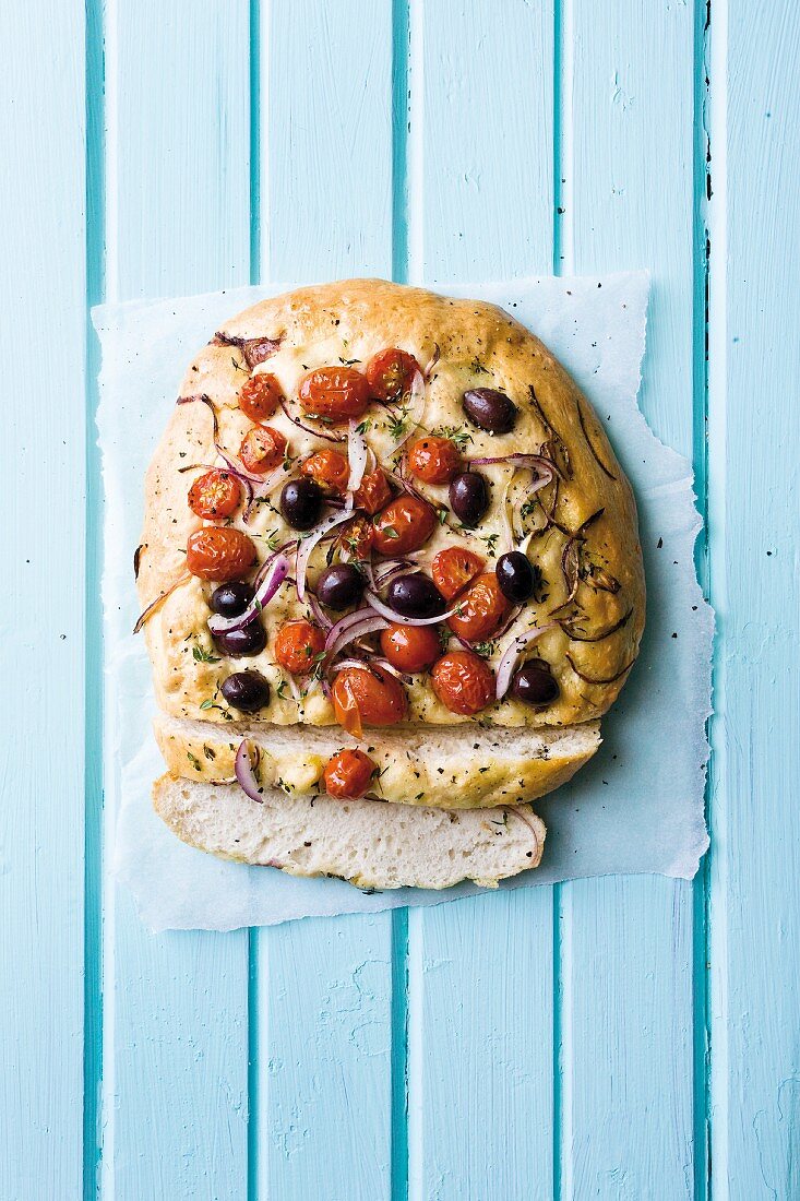 Unleavened bread with olives and tomatoes