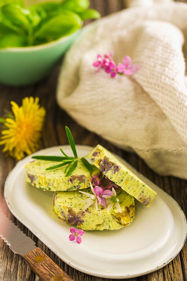 Blossom and herb butter with lilac flowers and dandelion flowers