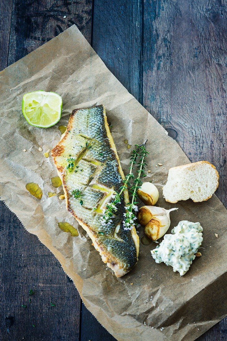 Grilled sea bass with roulade and thyme flowers