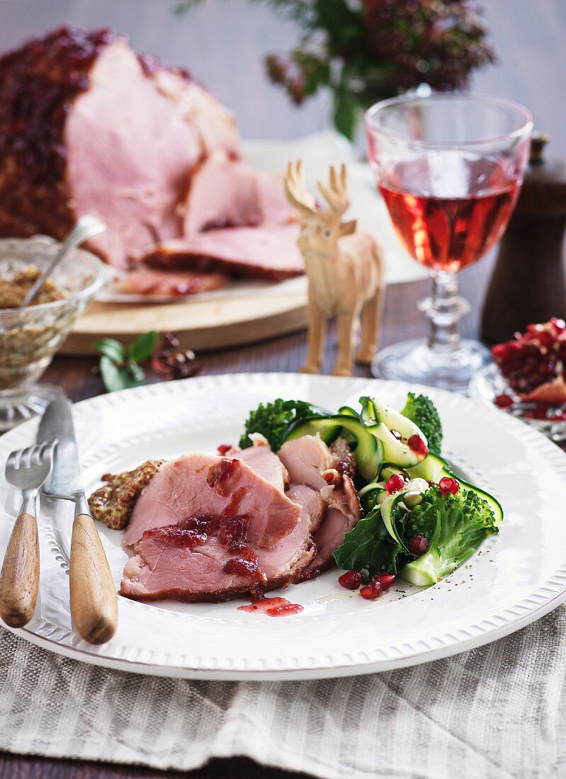 Roast ham with broccoli and pomegranate seeds for Christmas
