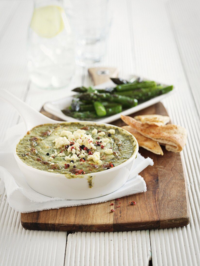 A spinach dip with pepper for asparagus