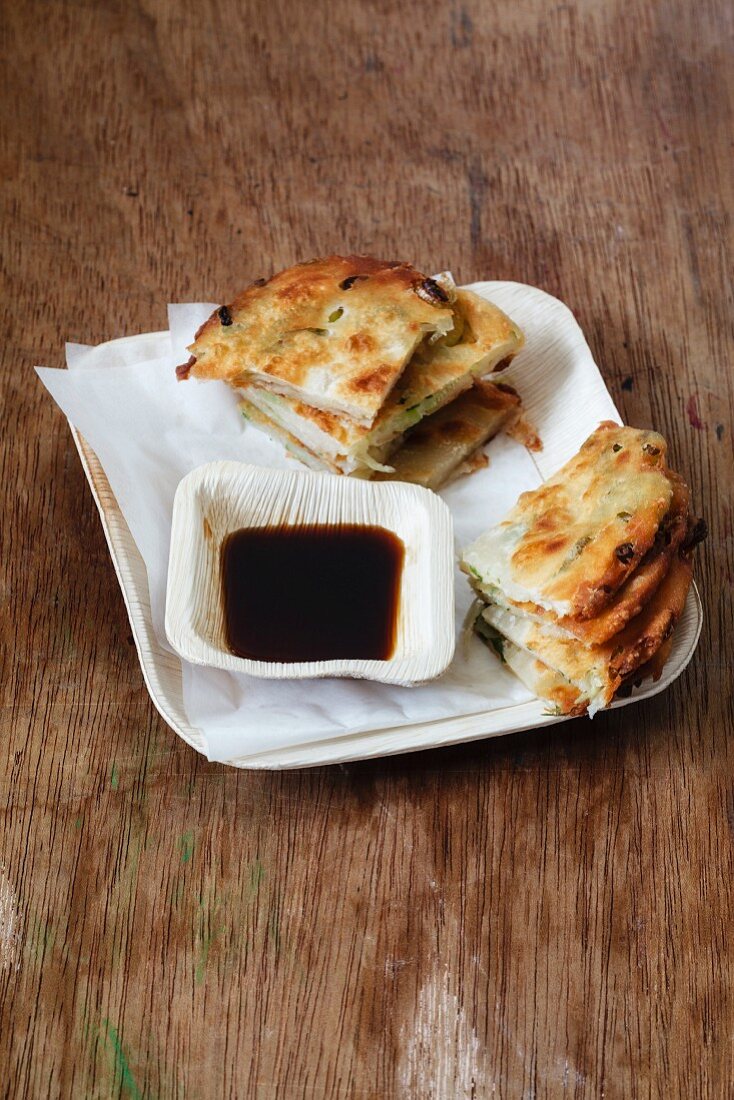 Cong you bing (fried spring onion unleavened bread with a soy dip, China)