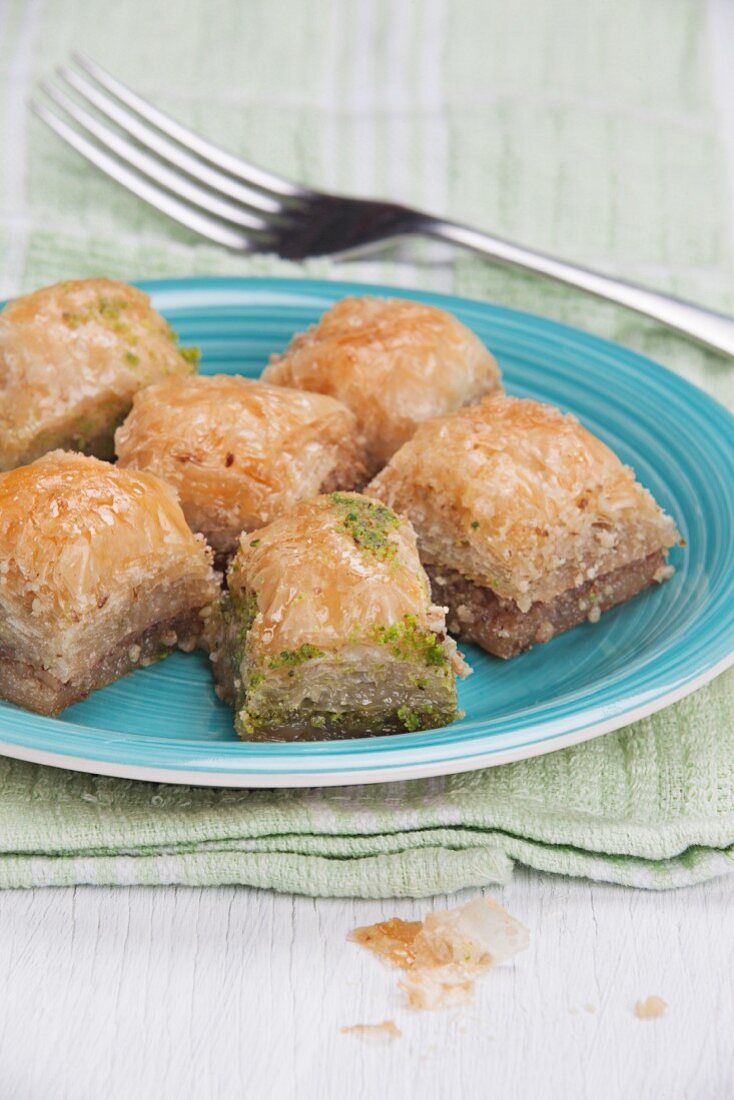 A plate of baklava on a napkin