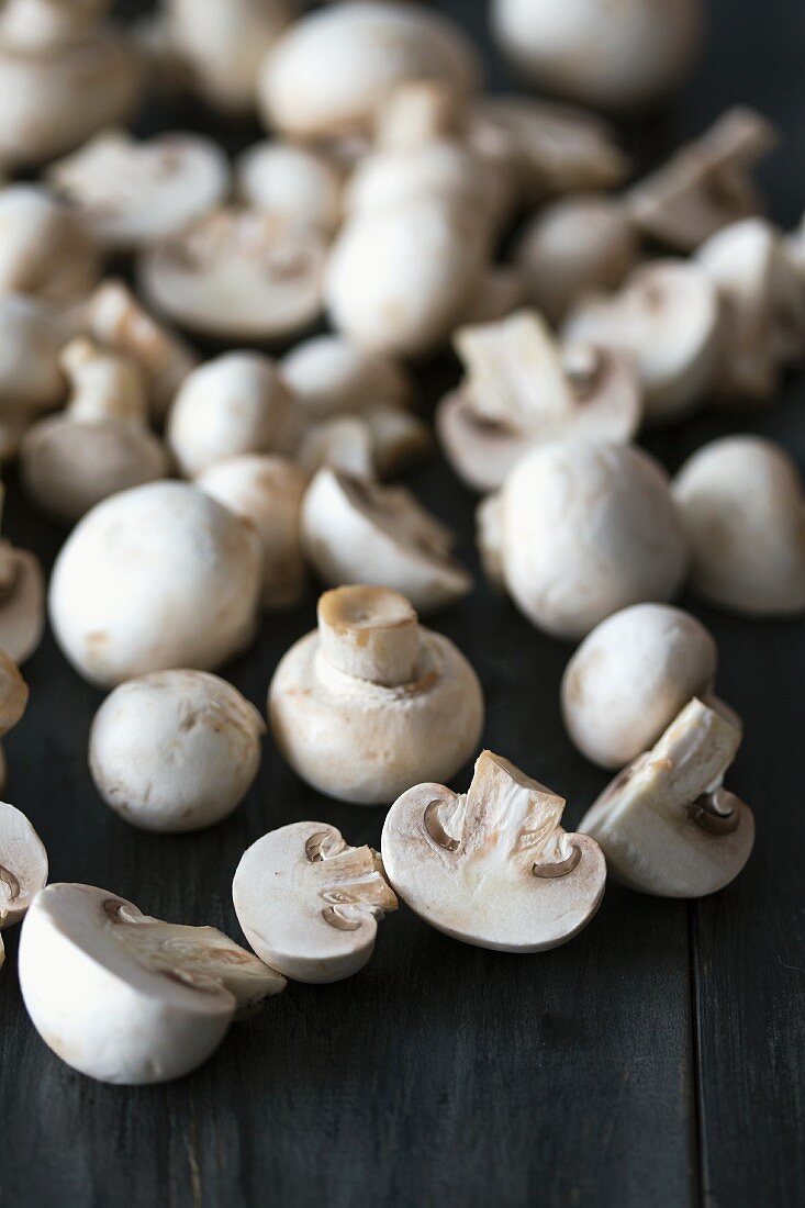 Fresh mushrooms on a dark wooden surface