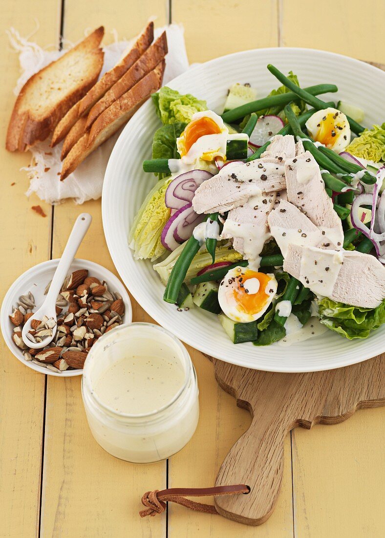 Caesar salad with chicken, runner beans and egg
