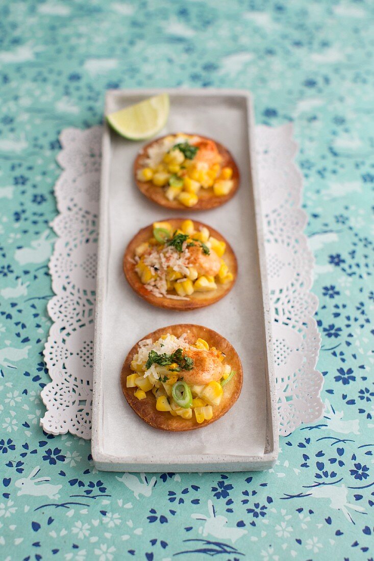 Sweetcorn tostadas with mayonnaise, Parmesan cheese and coriander