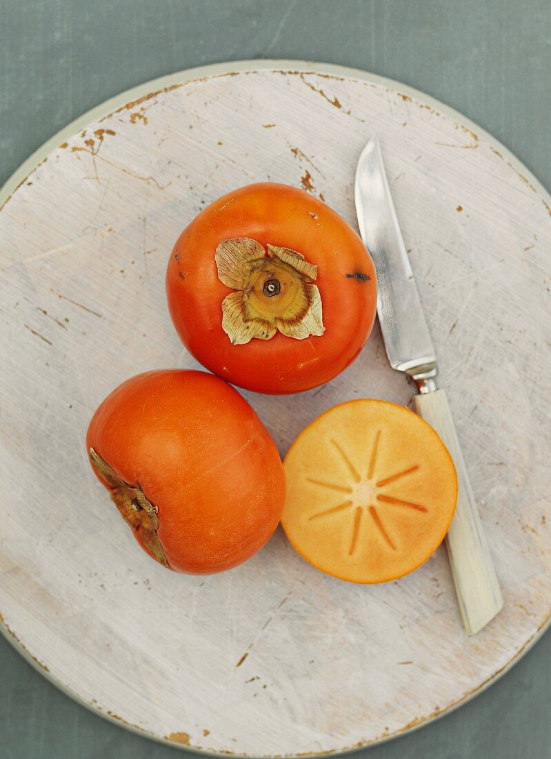 Persimions, whole and halved