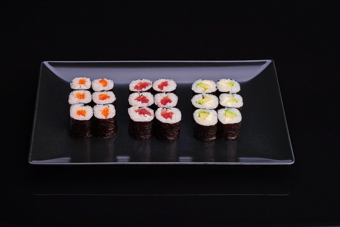 A sushi platter with various nori maki