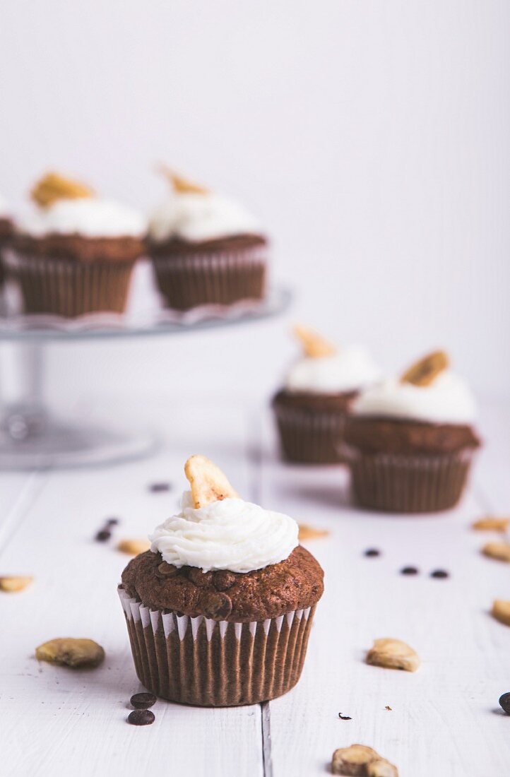 Cupcakes with banana frosting and banana chips