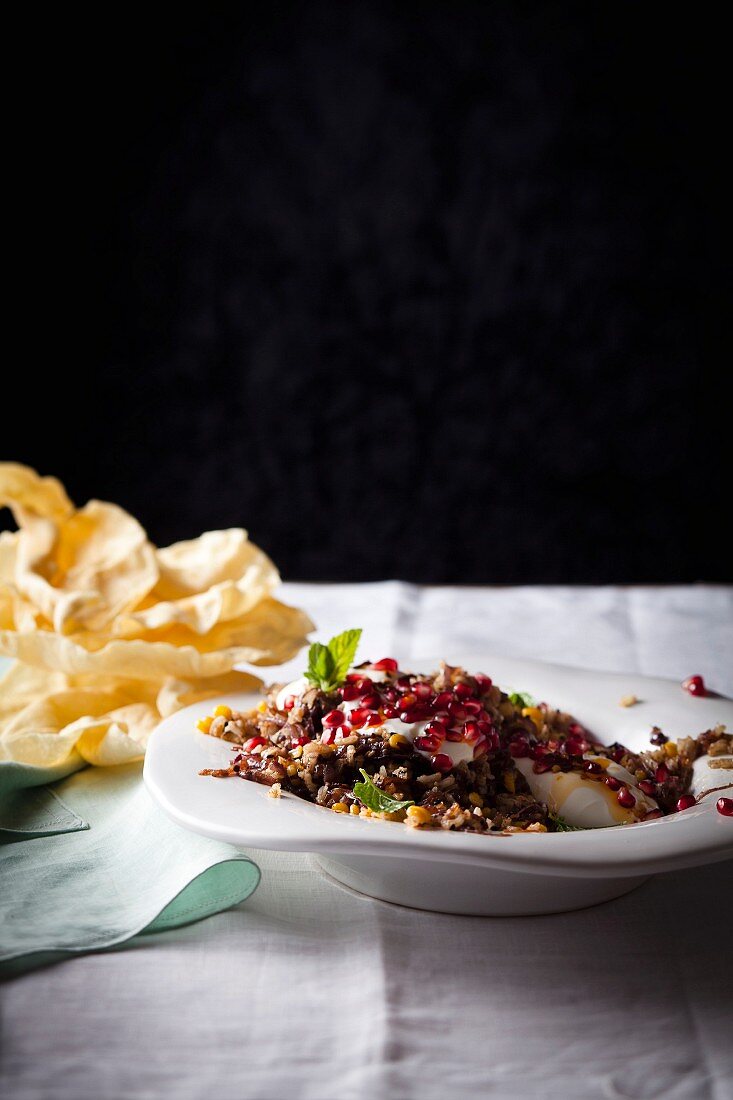 Lentil and rice pilau with yoghurt and pomegranate seeds