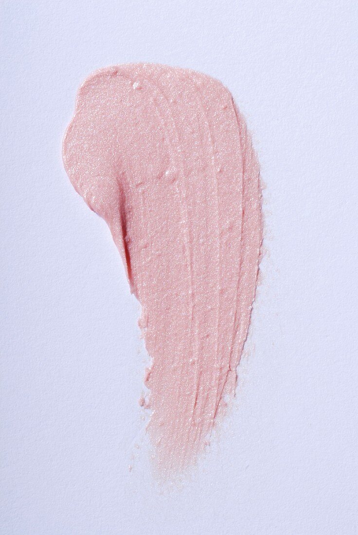 Light-pink lipstick on a white surface
