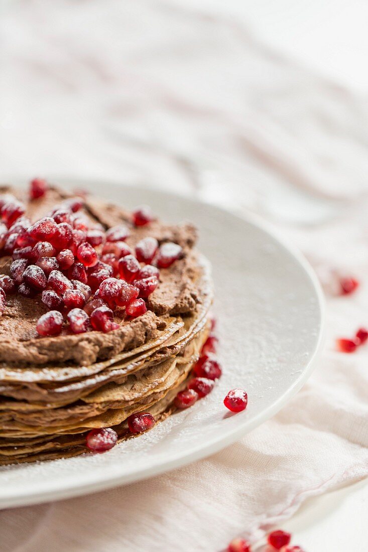 Crepes cake with pomegranate seeds