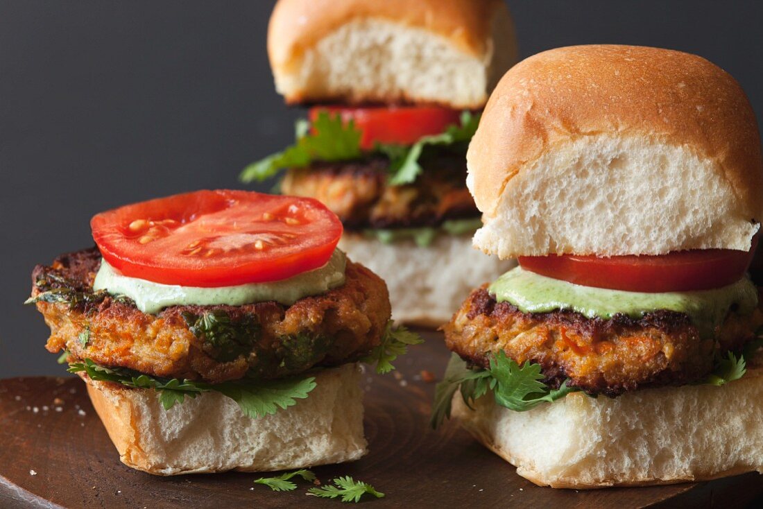 Indian veggie burgers on a wooden board