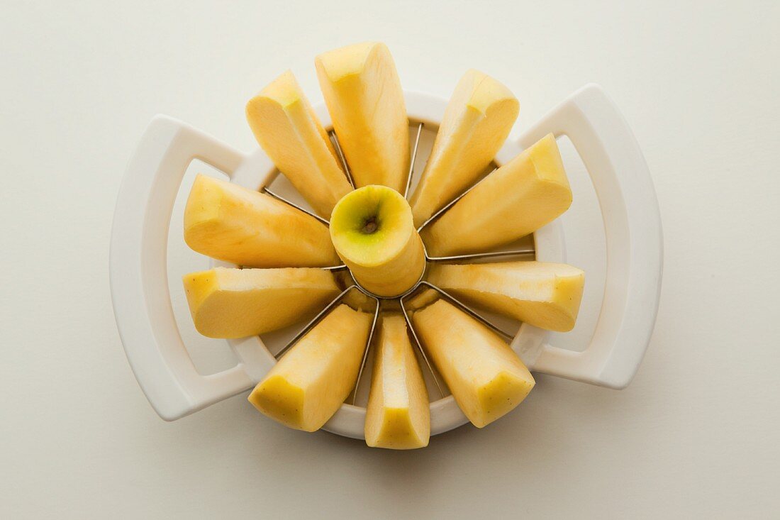 An apple in an apple slicer