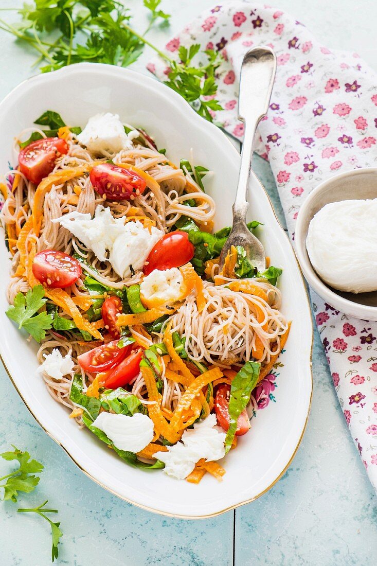 Rice noodles with sweet potato spirals, tomatoes, chard and mozzarella