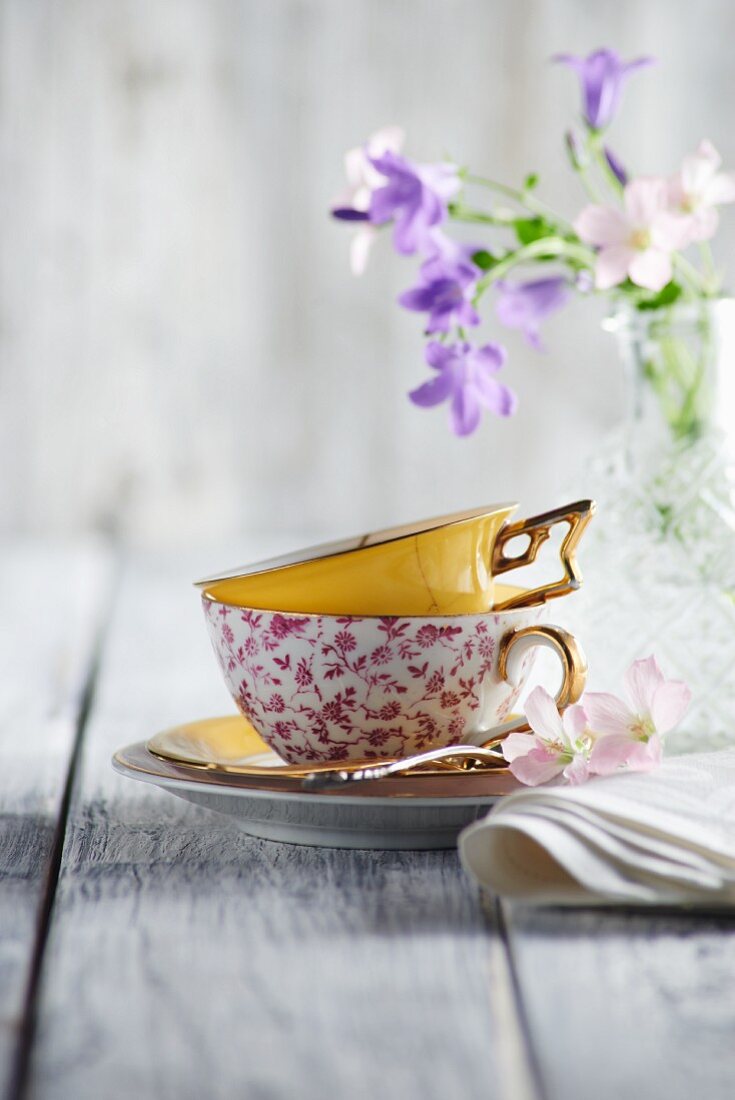 A coffee cup and spring flowers
