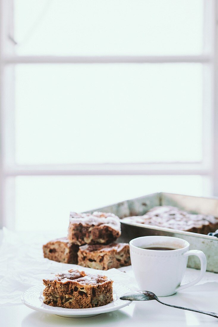 Apple and walnut cake and a cup of coffee