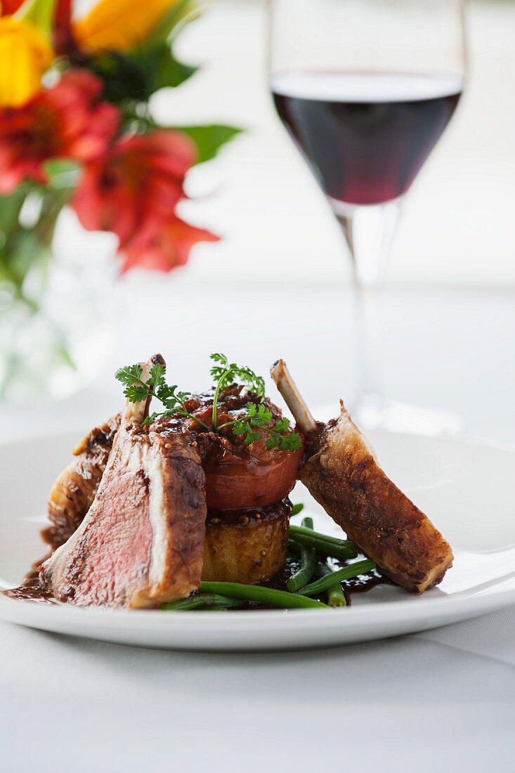 Lamb chops with grilled tomatoes and beans