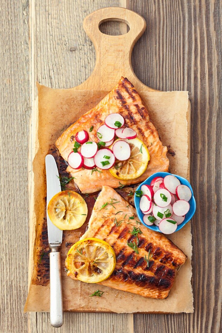 Grilled salmon with a honey and soy sauce glaze with radishes, spring onions and dill