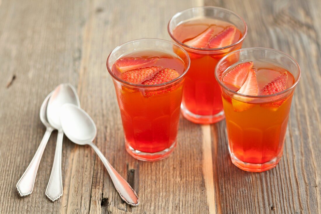 Three glasses of strawberry and lemon jelly