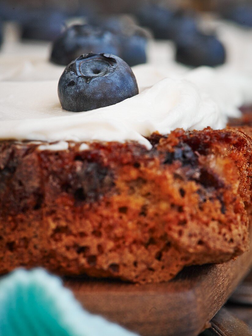 Apple and nut cake with cream cheese and blueberries