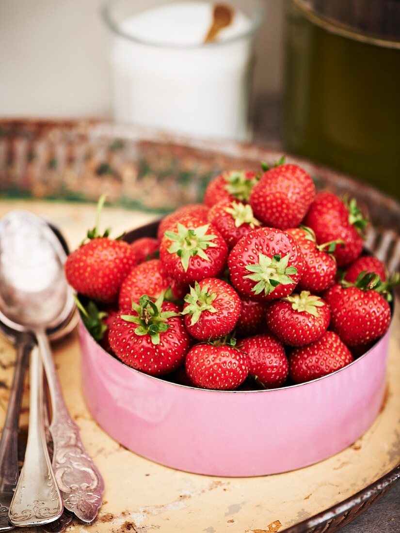 Fresh strawberries in an enamel pot