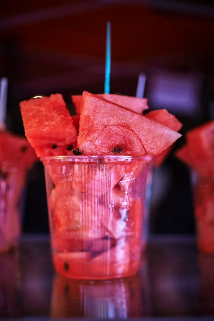 Pieces of watermelon in a plastic cup