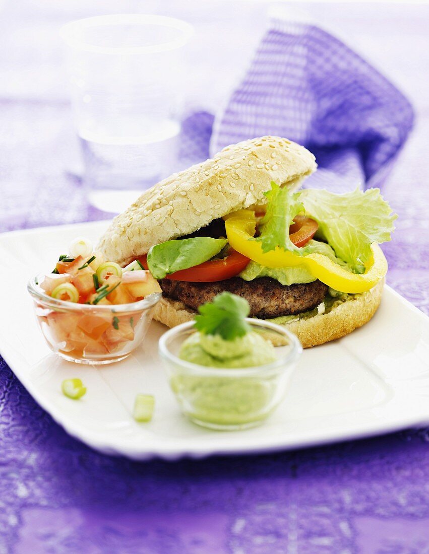 Hamburger, tomato salsa and avocado cream