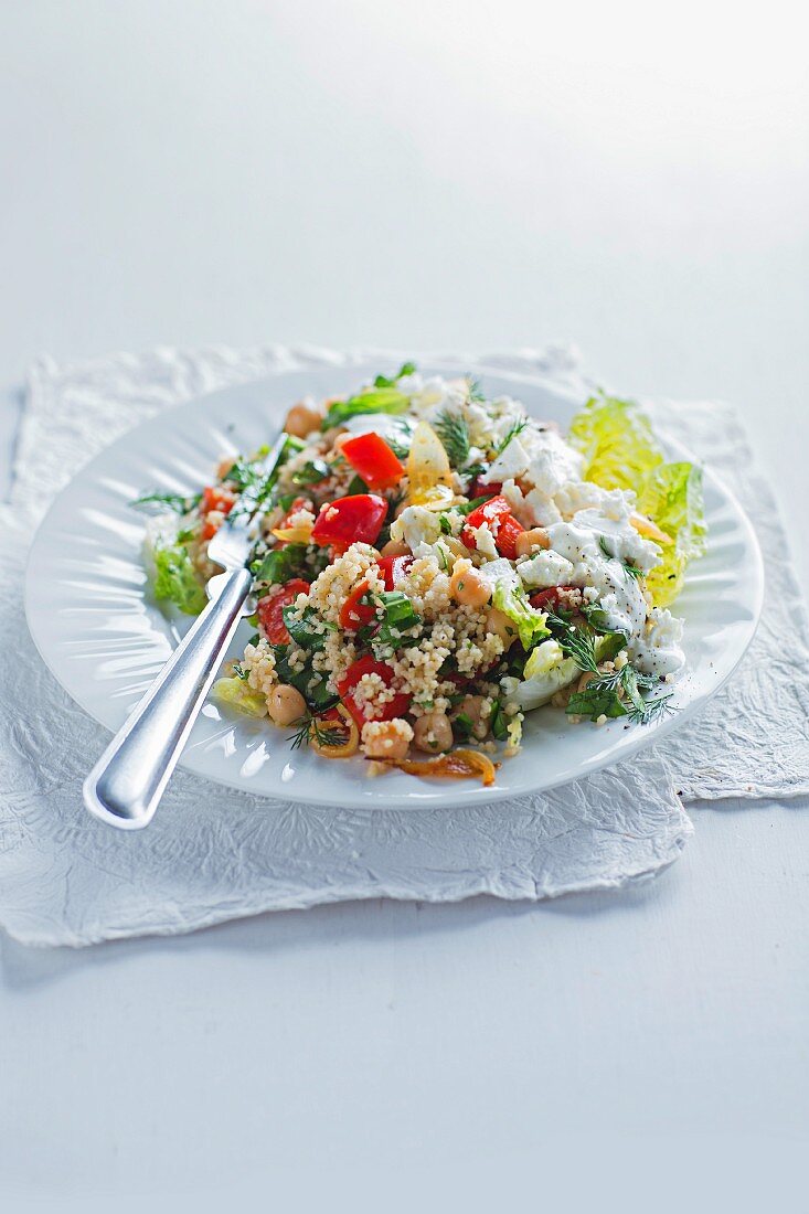 Chickpea salad with couscous, peppers and feta cheese