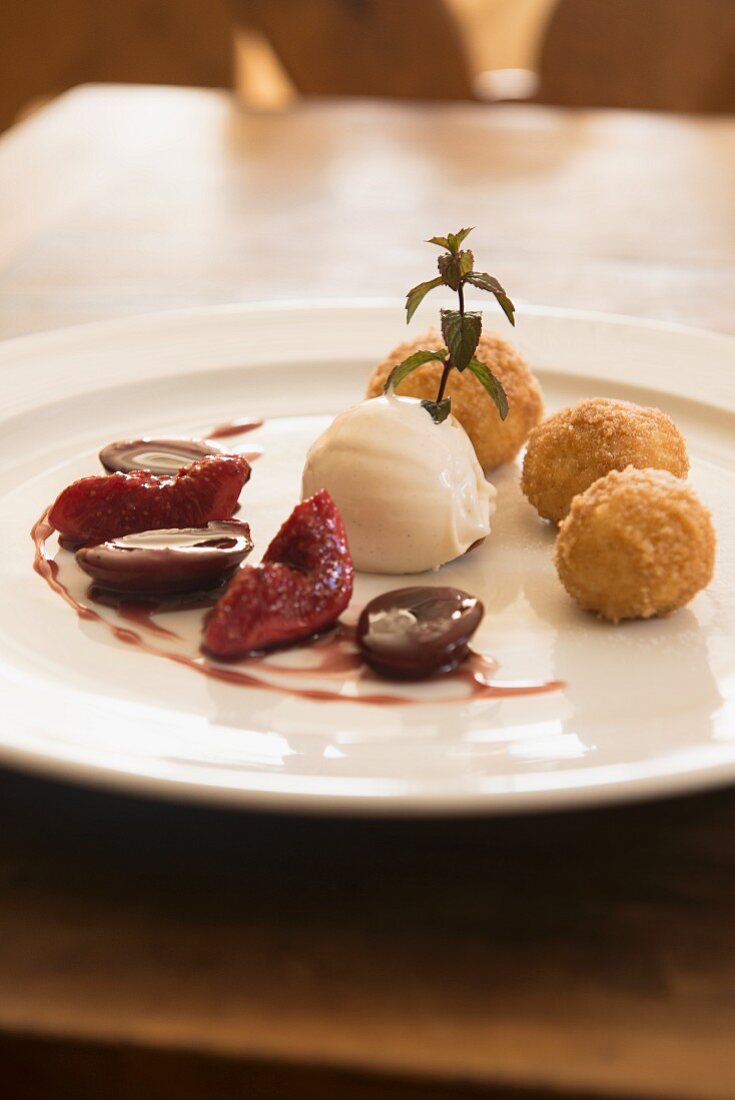 Quark dumplings, ricotta and pepper ice cream and red wine damsons in Unterwirt, South Tyrol