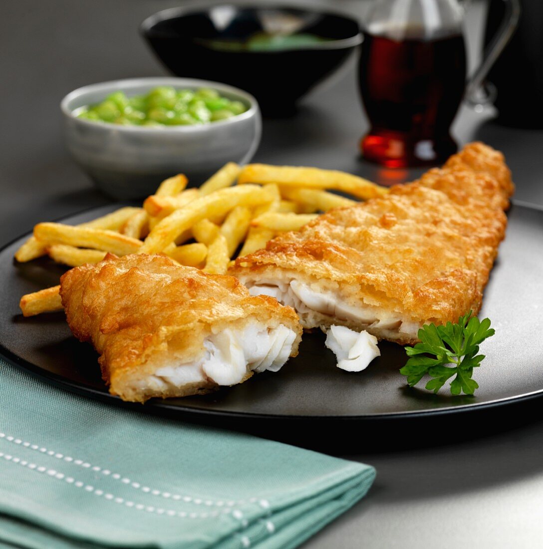 Battered haddock with fries and mushy peas